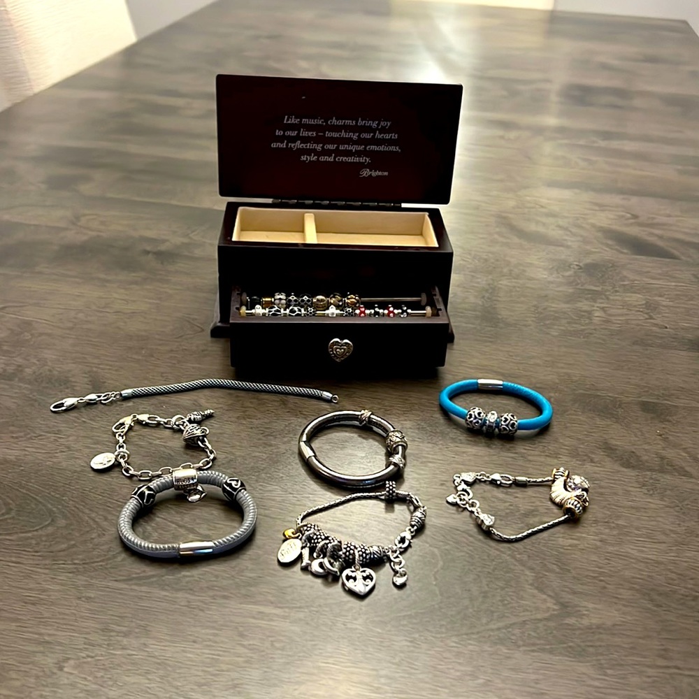 Brighton jewelry box and seven bracelets with various charms